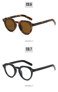 Detail view of retro oval PC sunglasses with silver rivets and 45-degree angle display