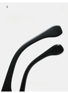 Close-up of curved glossy black temple tips on sunglasses for comfortable daily wear