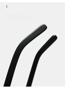 Detailed macro view of curved ergonomic temple tips on black oval sunglasses