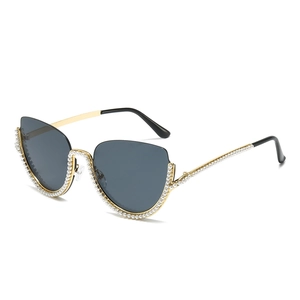 Fashionable half-rim cat eye sunglasses with gold frames and white faux pearl embellishments