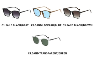 Flat lay of oval sunglasses in black, tortoiseshell, and transparent frames with rivets