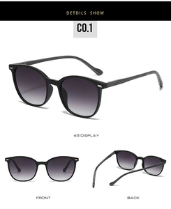 Detail view of oval sunglasses featuring grey wood grain temples and gradient lenses