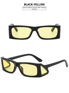 Detail of black rectangular sunglasses featuring distinctive yellow side shields and lenses