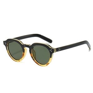 Retro oval fashion sunglasses with black and amber frames and green lenses in a 45-degree view