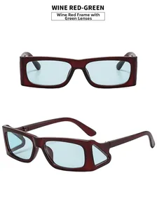 Detail view of wine red rectangular frame with green lenses and triangle side windows