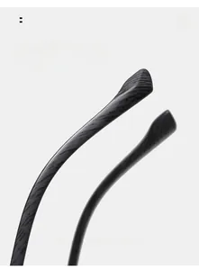 Detail view of oval sunglasses with curved wood-grain texture legs for comfortable wear