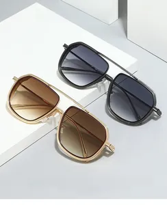 Detail of square oversized metal sunglasses with double bridge and gradient lenses