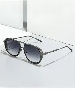Detail of metal aviator sunglasses frame with vertical texture and grey gradient lenses