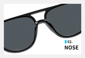 Detailed macro view of the comfortable nose bridge on these sleek black sunglasses