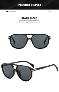 Detail of aviator sunglasses with glossy black frames and dark gray polarized lenses