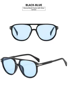 Detail of aviator sunglasses with black double-bridge frame and light blue lenses