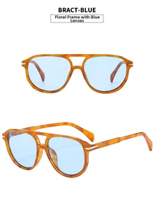 Detail of pilot sunglasses featuring tortoiseshell frame and translucent blue lenses