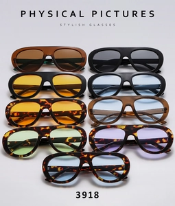Collection of vintage oval sunglasses in nine colors with tinted lenses and acetate frames