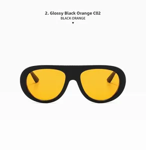 Detail shot of vintage oval sunglasses in bright black frame with orange lenses C02