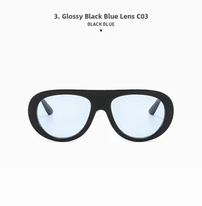 Detail view of oval sunglasses with bright black frames and light blue tinted lenses