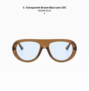 Detail of transparent brown frame with light blue lenses on retro oval sunglasses