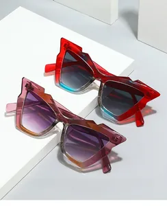 Detailed view of two trendy Y2K geometric sunglasses in red and purple resin frames