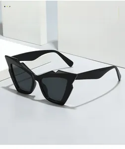 Detailed shot of black cat eye sunglasses with thick frames and unique geometric edges