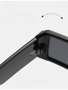 Detailed close-up of a durable metal hinge on retro Y2K black wrap sunglasses