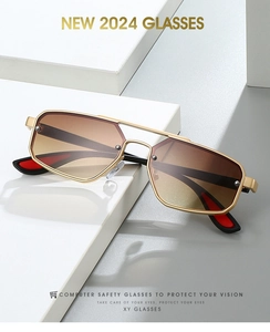 Close-up of double-bridge pilot sunglasses with gold metal frame and gradient lenses