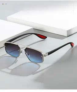 Detail of silver double bridge aviator sunglasses with blue gradient lenses and metal frame