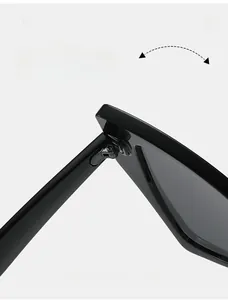 Detailed macro view of durable metal hinges on sleek black cat-eye sunglasses frames