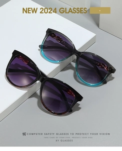 Detail view of retro cat-eye sunglasses featuring twisted temple design and gradient lenses