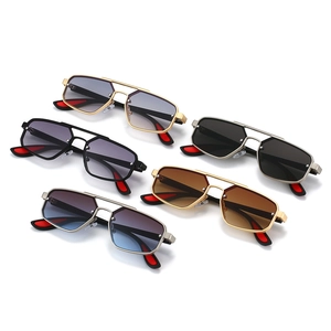Five pairs of trendy double-bridge metal sunglasses in assorted colors with a retro vibe