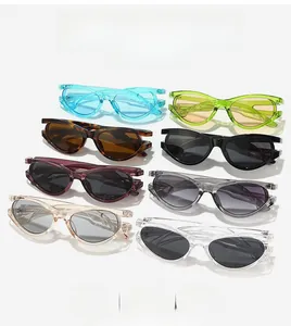 Flat lay of oval sunglasses in eight colors like tortoiseshell and translucent resin frames