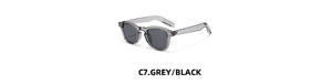 Detail of C7 grey translucent frames and dark lenses on retro Boston style sunglasses