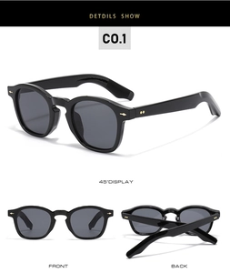 Classic black sunglasses detail showing gold metal rivet accents from multiple angles