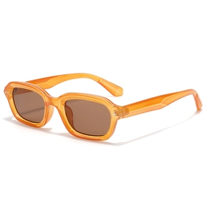 Narrow rectangular punk sunglasses with transparent amber frames and brown lenses