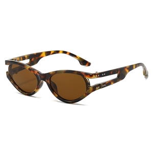 Chic tortoiseshell oval sunglasses for women with trendy brown lenses and cutout frames