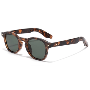 Retro tortoise shell sunglasses with dark green lenses and diamond rivet accents
