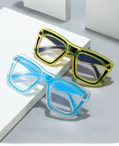 Close-up of stylish contrast color frames and square blue light blocking eyewear lenses