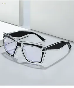 Close-up of trendy two-tone eyeglass frames with transparent and black geometric layers