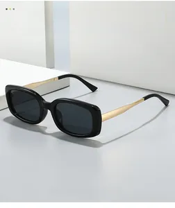 Detailed close-up of premium black square sunglasses with sleek gold metal temples