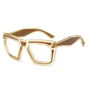 Modern thick-frame square eyeglasses in transparent amber yellow with brown accents