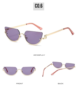 Detailed views of purple cat-eye sunglasses with gold half-rim frames and hollow patterns