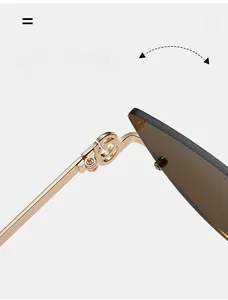 Detailed macro view of durable gold metal hinge on retro semi-rimless sunglasses