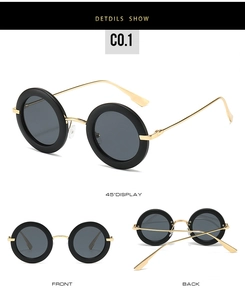 Detailed views of vintage oval sunglasses with thick black frames and gold metal temples