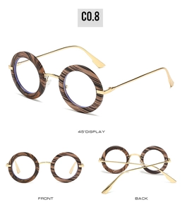 Retro oval sunglasses with dark wood grain frames and gold metal temples in three views