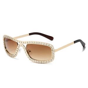 Lunettes de soleil ovales chic avec strass monture dorée et verres dégradés marron