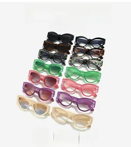 Detailed pile of multi-colored retro cat-eye sunglasses with modern plastic frames