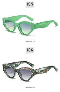Detail view of cat eye sunglasses showing translucent green and tortoiseshell frames at 45 degrees