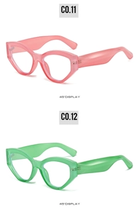 45-degree angle view of pink and green translucent cat-eye sunglasses with wide temples