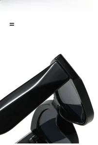 Detail shot of lightweight black cat-eye sunglasses with premium square frame hinges