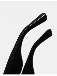 Detail of curved mirror legs on cat eye sunglasses for arc comfortable wear