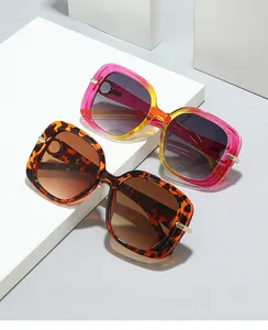 Detail of square computer safety glasses in pink gradient and tortoiseshell with gold trim