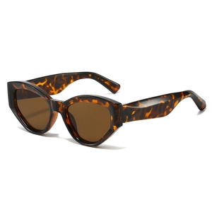 Retro cat-eye tortoiseshell sunglasses with dark brown lenses at a 45-degree angle